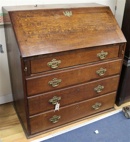 A George III oak bureau, 3ft 1in.